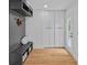 Convenient mudroom area with custom storage, a built-in bench, and natural light at 4209 Windwood Cir, Charlotte, NC 28226