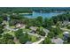 Aerial view overlooking a lakefront community with lush trees and diverse properties in a desirable setting at 4278 Harbor Ln, Sherrills Ford, NC 28673
