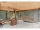View of a storage area in a basement with exposed rafters, concrete flooring and lawn care equipment at 4278 Harbor Ln, Sherrills Ford, NC 28673