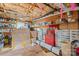View of the unfinished basement with storage shelving, exposed rafters, and concrete flooring at 4278 Harbor Ln, Sherrills Ford, NC 28673