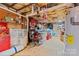 View of the unfinished basement with storage area, exposed rafters, and concrete flooring at 4278 Harbor Ln, Sherrills Ford, NC 28673