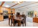 Open-concept dining area with a large wooden table, seamlessly connecting to the kitchen and living room at 4278 Harbor Ln, Sherrills Ford, NC 28673