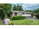 Charming home featuring a well-maintained lawn, a wooden deck, and a classic American flag at 4278 Harbor Ln, Sherrills Ford, NC 28673