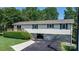 Attractive home featuring a well-manicured lawn and an accessible drive-under garage at 4278 Harbor Ln, Sherrills Ford, NC 28673
