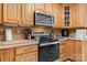 Modern kitchen featuring stainless steel appliances, light wood cabinets, and stylish tile at 4278 Harbor Ln, Sherrills Ford, NC 28673