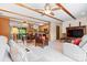 Spacious living room with exposed wooden beams, neutral-toned furniture, and an open layout to the kitchen at 4278 Harbor Ln, Sherrills Ford, NC 28673