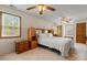 Comfortable bedroom featuring carpet, a ceiling fan, large furniture, and two windows for natural light at 4278 Harbor Ln, Sherrills Ford, NC 28673