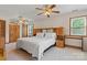 Spacious bedroom features carpet, a ceiling fan, large furniture, and a window for natural light at 4278 Harbor Ln, Sherrills Ford, NC 28673