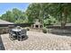 Backyard featuring a stone fireplace, dining table, and pavers at 5301 Addison Dr, Charlotte, NC 28211