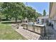 Backyard with an outdoor kitchen area featuring a stone fireplace and grill at 5301 Addison Dr, Charlotte, NC 28211