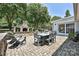 Backyard with a stone fireplace, pavers, and an outdoor dining table at 5301 Addison Dr, Charlotte, NC 28211