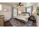 This bedroom features a ceiling fan, hardwood floors, and neutral paint at 5301 Addison Dr, Charlotte, NC 28211