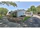 Charming white brick home showcasing manicured landscaping and an inviting front porch at 5301 Addison Dr, Charlotte, NC 28211