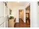 Bright foyer with hardwood floors, a console table, and views into other rooms at 5301 Addison Dr, Charlotte, NC 28211