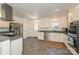 Well-lit kitchen equipped with stainless steel appliances, white cabinets, and granite countertops at 5301 Addison Dr, Charlotte, NC 28211