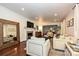 Spacious living room featuring a fireplace, large mirror, and comfortable seating area at 5301 Addison Dr, Charlotte, NC 28211