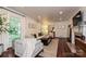 Bright living room boasting hardwood floors, a decorative rug, and ample natural light through large windows at 5301 Addison Dr, Charlotte, NC 28211