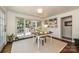 Bright office with hardwood floors, custom built-in shelves and french doors leading to the back patio at 5301 Addison Dr, Charlotte, NC 28211