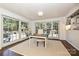 Bright office with hardwood floors and multiple french doors leading to the back patio at 5301 Addison Dr, Charlotte, NC 28211