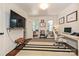 Office with hardwood floors and natural light. Features a modern desk, tv, and decor at 5301 Addison Dr, Charlotte, NC 28211