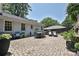 Stone paved back patio features outdoor dining table and chairs at 5301 Addison Dr, Charlotte, NC 28211