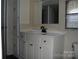 Bathroom featuring a sink with vanity, a mirror, a window, and a built in cabinet for ample storage at 561 Woodglenn Rd, Catawba, SC 29704