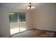 Bright dining room with hardwood floors has sliding door access to the home's wood deck at 561 Woodglenn Rd, Catawba, SC 29704