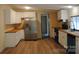 Bright kitchen features white cabinets, stainless steel appliances, wood countertops, and hardwood style floors at 561 Woodglenn Rd, Catawba, SC 29704