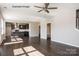 Spacious living area showcasing hardwood floors and an open layout into kitchen at 6140 Balham Ct # Ken0059, Charlotte, NC 28215