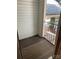 A cozy outdoor balcony featuring wood flooring and a view of surrounding greenery at 6260 Rosecroft Dr, Charlotte, NC 28215