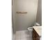 A bright bathroom features clean white tile floors and essential fixtures at 6260 Rosecroft Dr, Charlotte, NC 28215