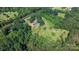 A charming home nestled among mature trees on a beautiful lot offering tranquility and privacy at 6314 Providence Church Rd, Vale, NC 28168