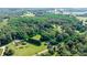 Expansive property boasts a mix of wooded areas and open fields, offering privacy and natural beauty at 6314 Providence Church Rd, Vale, NC 28168
