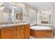 Bathroom features a soaking tub, double sink vanity, and natural light at 6314 Providence Church Rd, Vale, NC 28168
