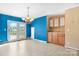 Dining area with french doors and built-in cabinets on a wall with two-tone paint at 6314 Providence Church Rd, Vale, NC 28168