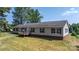 Charming ranch home with a welcoming front porch and well-maintained lawn in a serene setting at 6314 Providence Church Rd, Vale, NC 28168