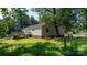 Exterior view featuring a wooden deck, picnic table, and spacious yard, great for relaxation at 6314 Providence Church Rd, Vale, NC 28168
