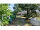 Charming home with a gravel driveway, lush greenery, and blue hydrangea bushes at 6314 Providence Church Rd, Vale, NC 28168