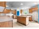 Kitchen featuring wooden cabinets, an island, and abundant counter space at 6314 Providence Church Rd, Vale, NC 28168
