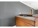 Compact kitchenette features a sink, under-cabinet storage, and a laminate countertop at 6314 Providence Church Rd, Vale, NC 28168