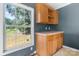 A kitchenette area features ample cabinetry and a window overlooking an outdoor area at 6314 Providence Church Rd, Vale, NC 28168