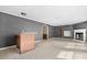 Spacious living room with fireplace and built-in shelves, seamlessly connects to a bar area at 6314 Providence Church Rd, Vale, NC 28168