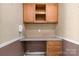 A functional office area features wood cabinetry, laminate counters, and a wall-mounted phone at 6314 Providence Church Rd, Vale, NC 28168