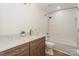 This bathroom features a shower/tub combo with subway tile, storage vanity, and quartz countertop at 633 Portside Dr, Davidson, NC 28036