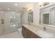 Updated bathroom with a glass-enclosed shower, dual sinks, and modern fixtures at 633 Portside Dr, Davidson, NC 28036