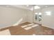 Bright bedroom featuring hardwood floors, large windows, and a ceiling fan for comfort at 633 Portside Dr, Davidson, NC 28036