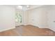 This bedroom features hardwood floors, fresh paint, and large window with natural light at 633 Portside Dr, Davidson, NC 28036