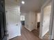 Bright entryway featuring hardwood floors, white trim, and entry to kitchen and bathroom at 633 Portside Dr, Davidson, NC 28036
