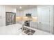 Modern kitchen featuring white cabinets, stainless steel appliances, a tile backsplash, and large sink at 633 Portside Dr, Davidson, NC 28036