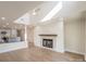 Bright living room featuring fireplace, hardwood floors, and a kitchen in the background at 633 Portside Dr, Davidson, NC 28036